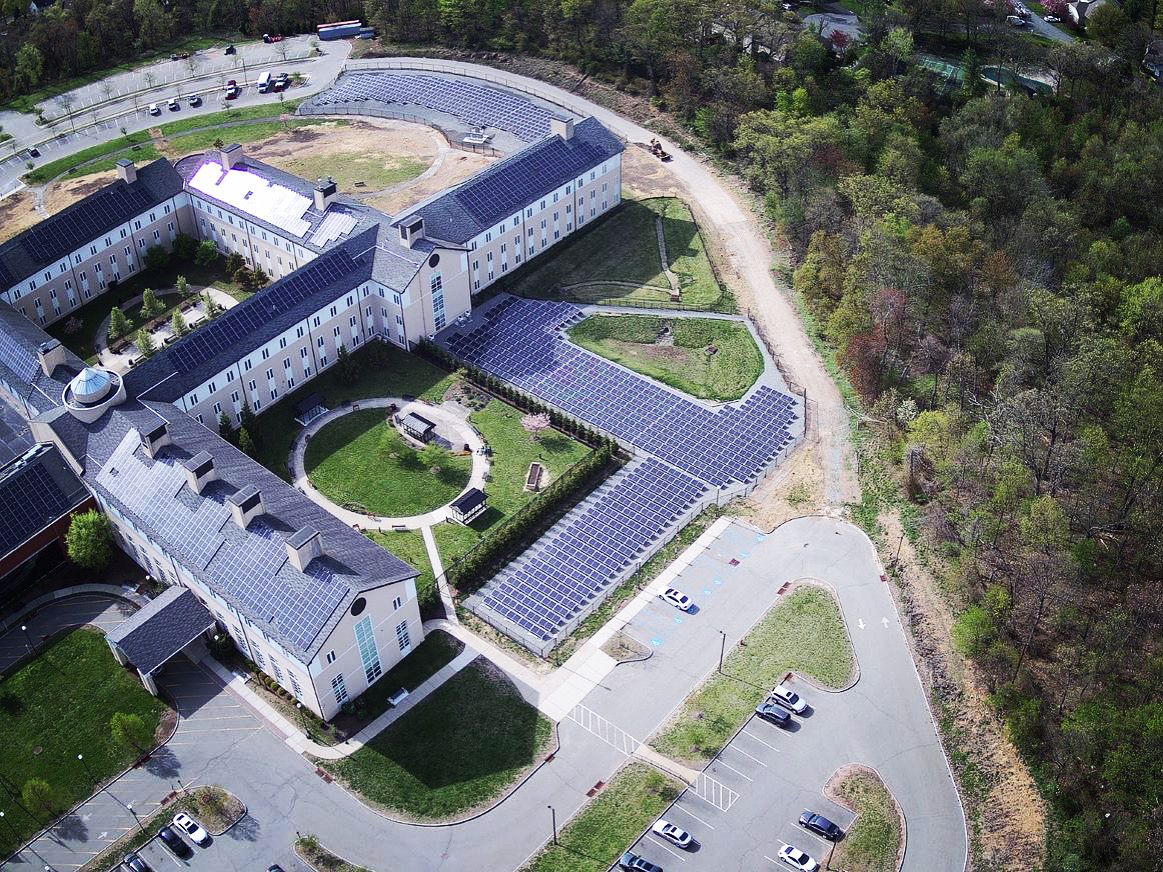 Aerial photo on rooftop and ground mount solar panel array in New Jersey - Onyx Renewables