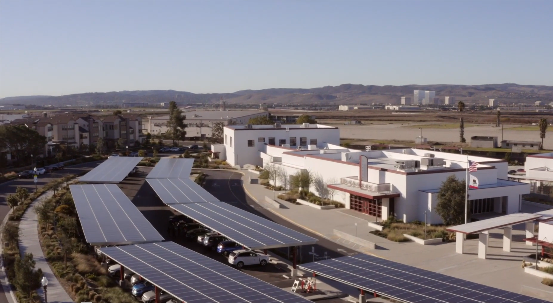 Aerial view of solar carport canopy in the parking lot of a school in California - Onyx Renewables