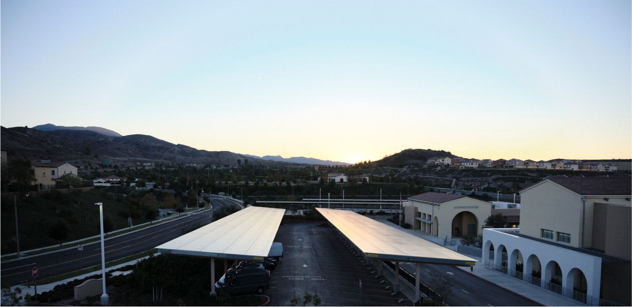 Side view of carport canopy solar panel installation in a parking lot - Onyx Renewables