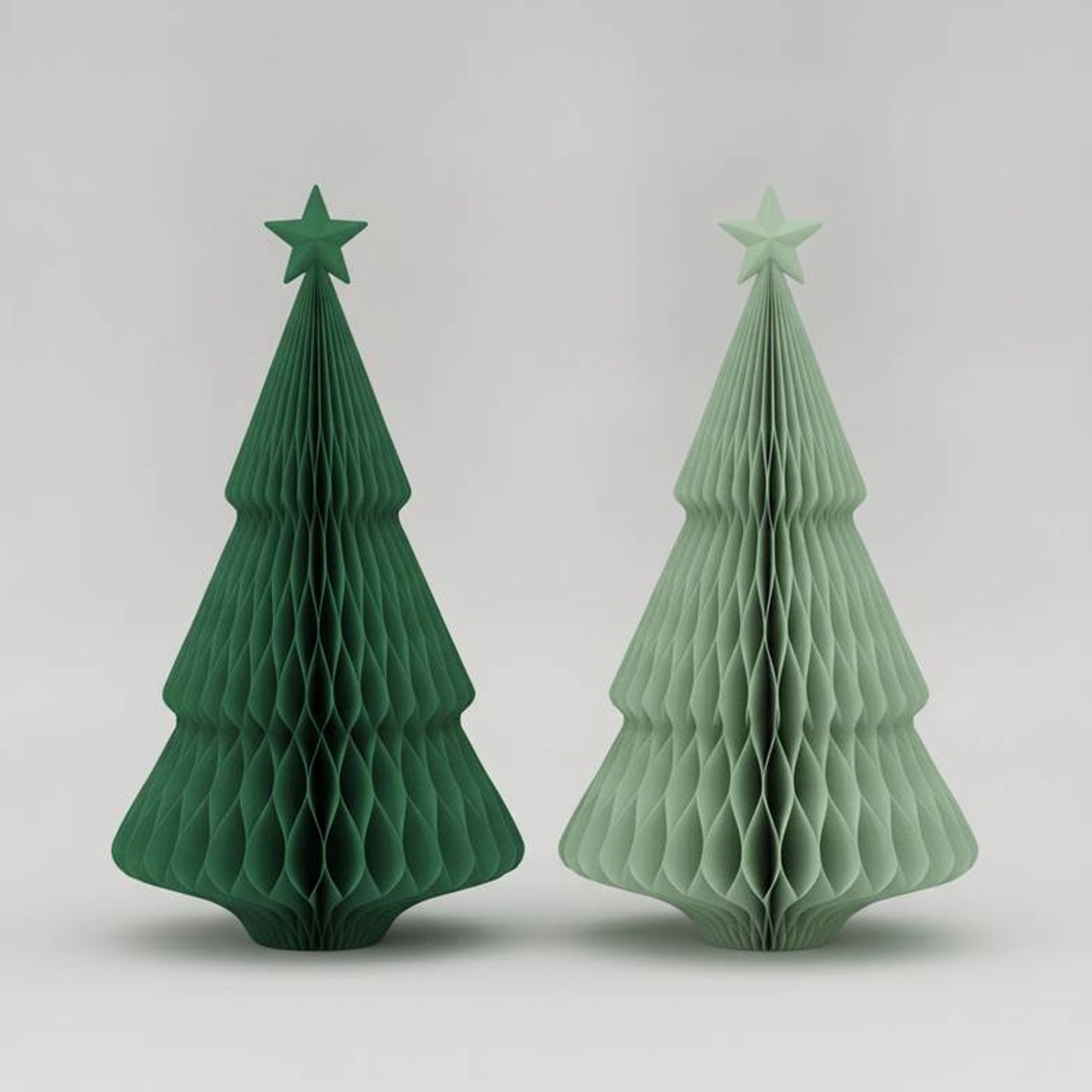 Side-by-side comparison of two paper decoration samples showing slight color variation