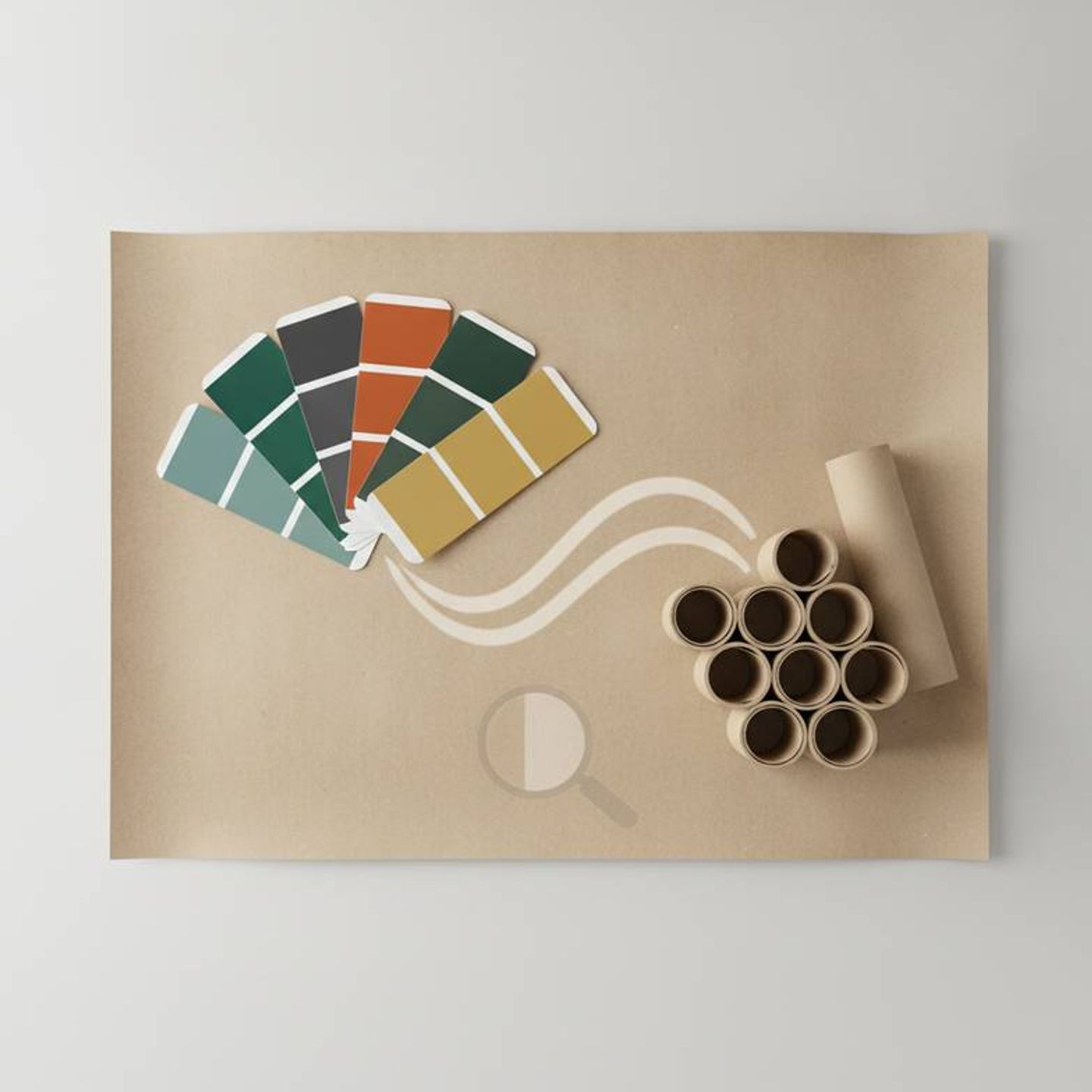 Pantone color swatches fanned out over a sheet of raw paper material for honeycomb decorations.