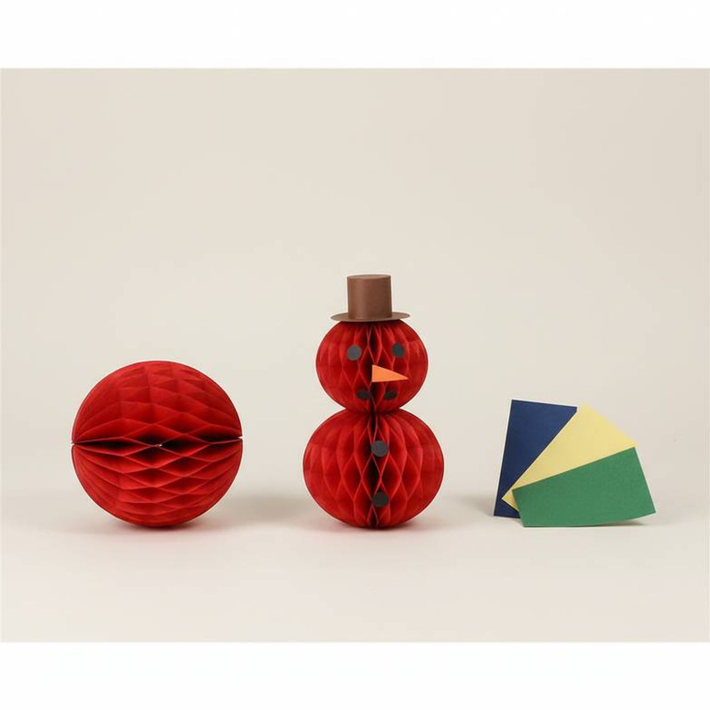 A manufacturer and client collaborating on modifying an existing honeycomb paper decoration design.