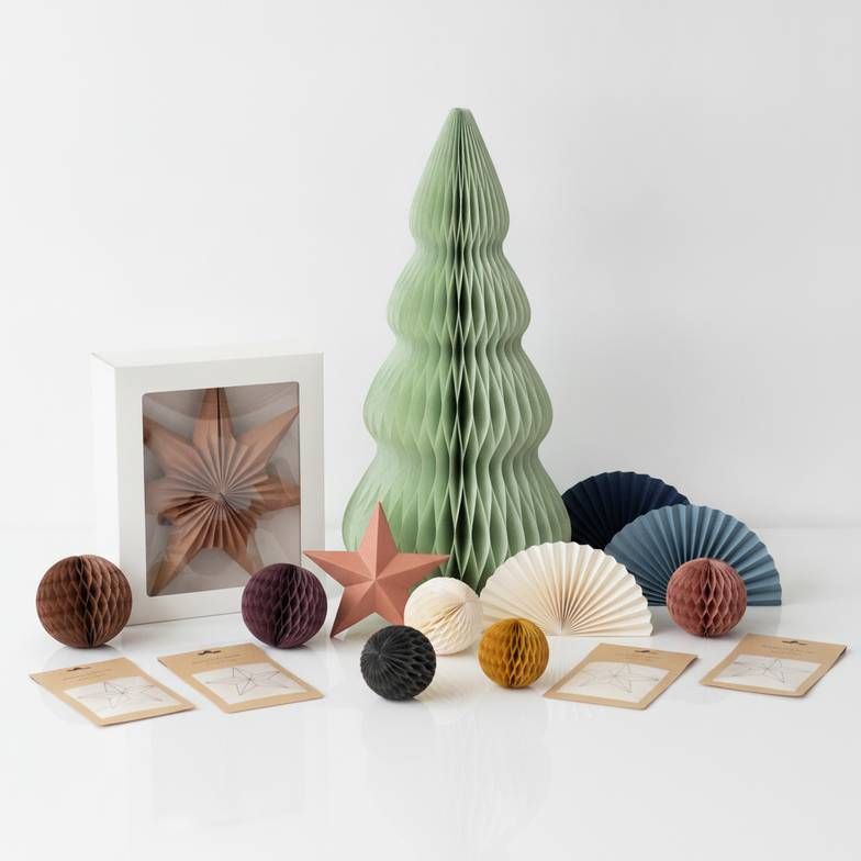 A full retail-ready collection of private label honeycomb paper decorations with cohesive packaging