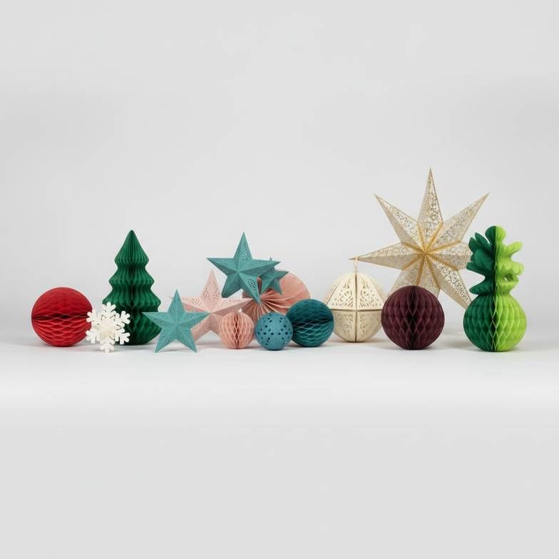 A collection of honeycomb paper decorations in various custom colors and unique shapes.