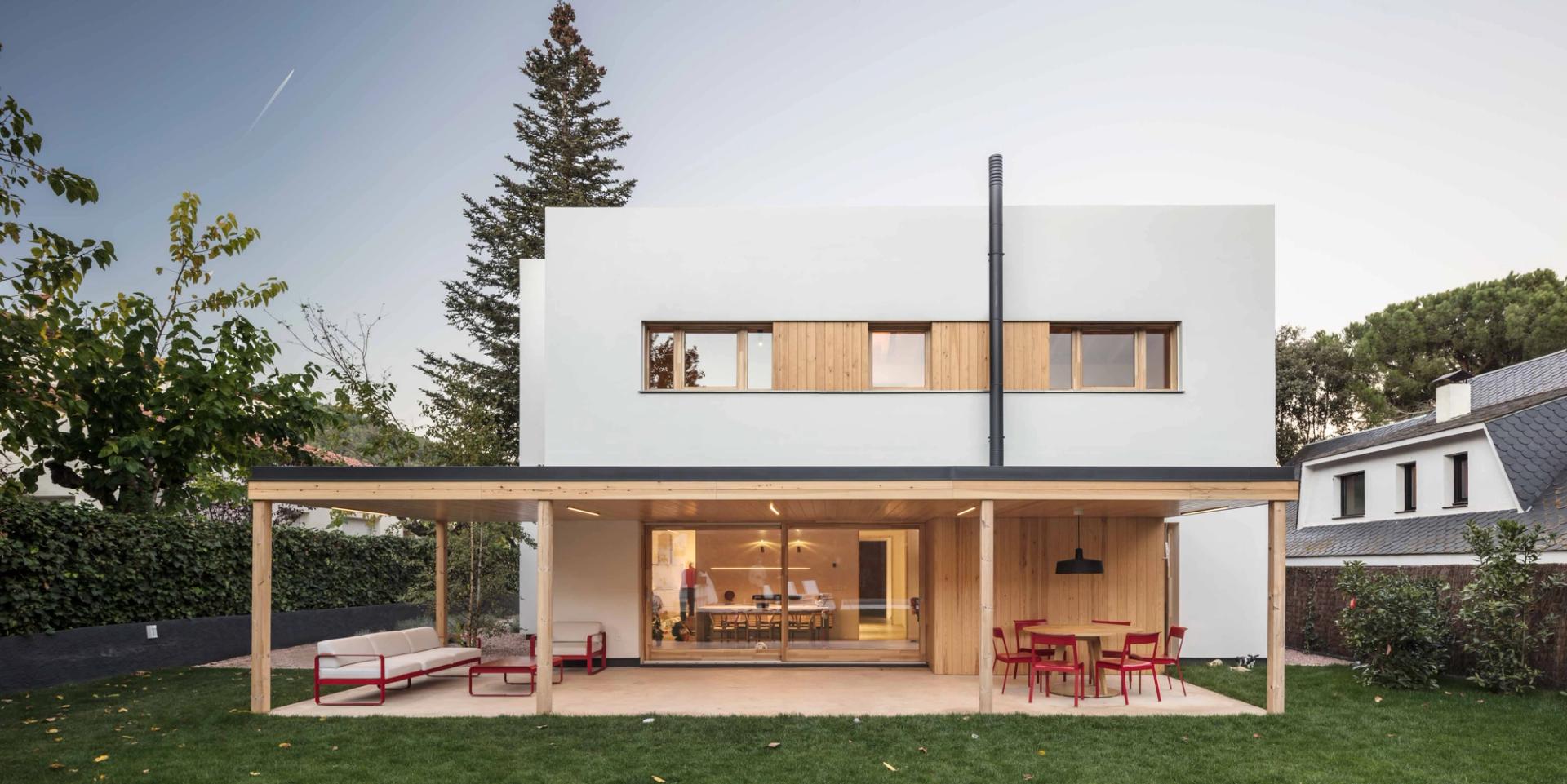 Inner façade of Casa NOA in Catalonia with gallery overlooking the garden and pool