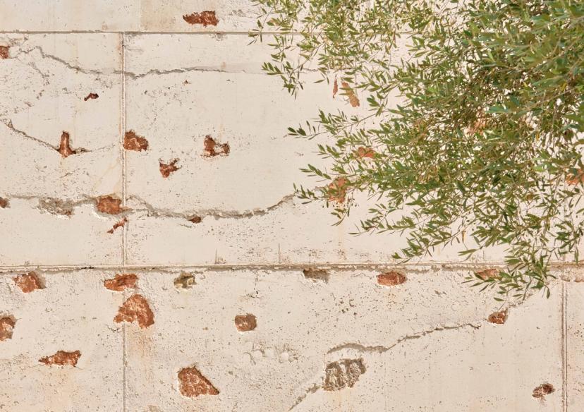 Detail of the cyclopean wall with stones from the site excavation in the Ses Veles building in Puigpunyent