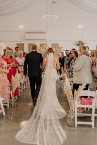 A bride walking down the aisle
