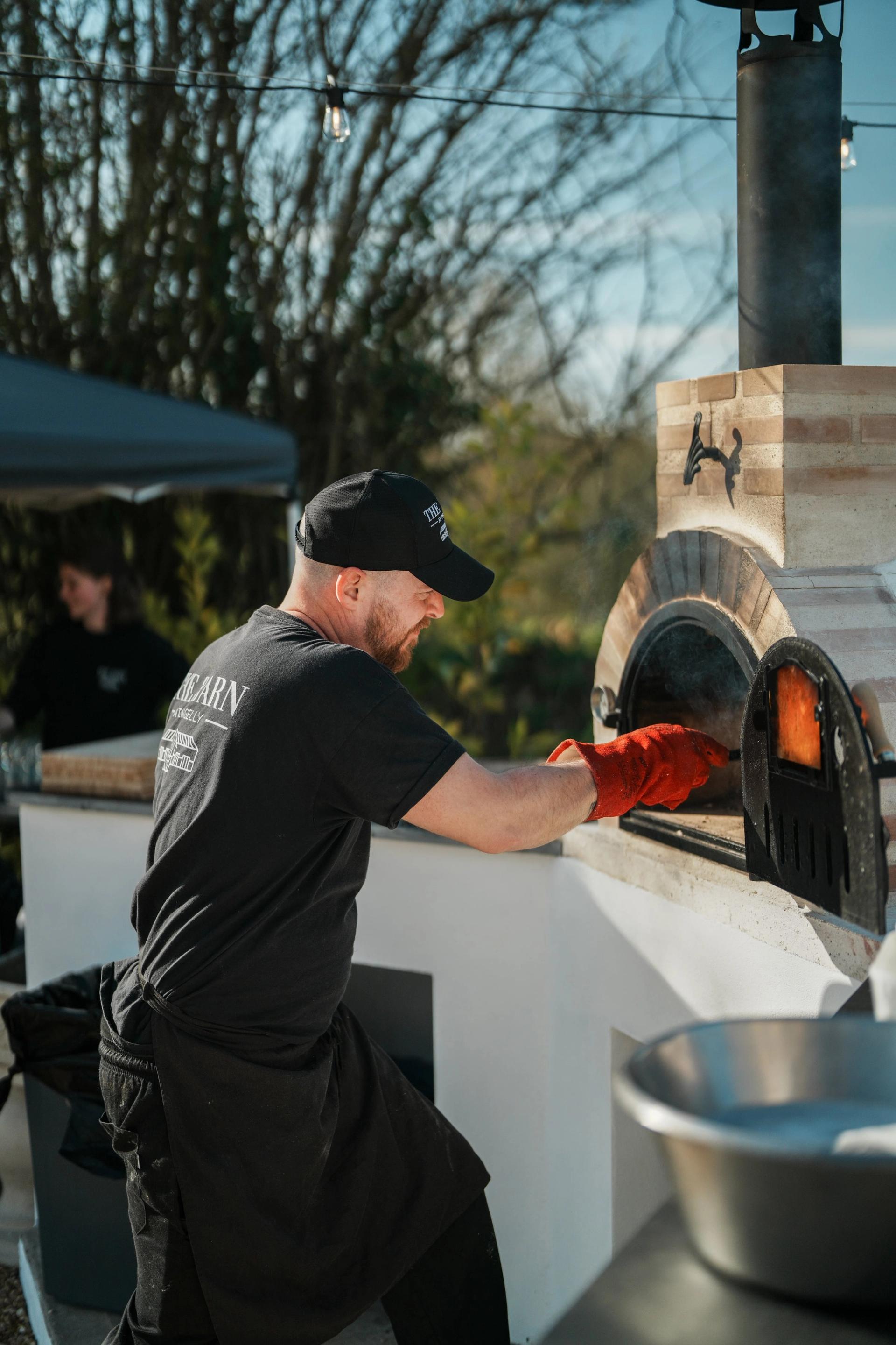 Food going into the pizza oven