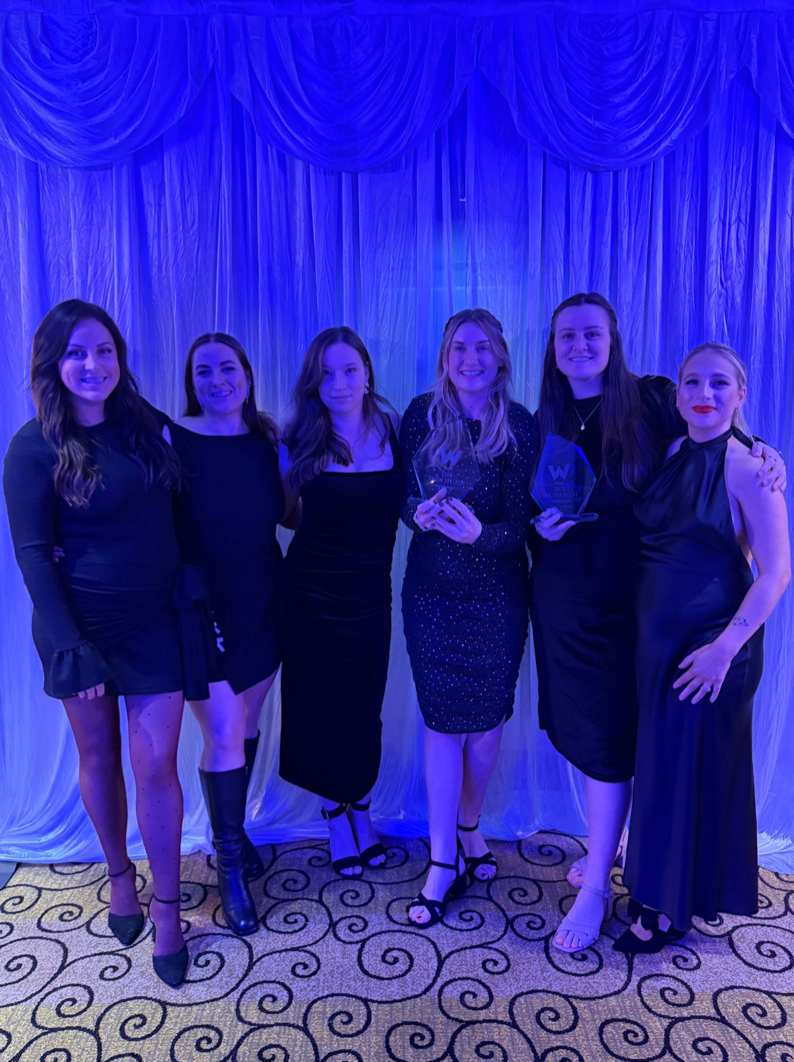 Photo of the wedding team at an awards event