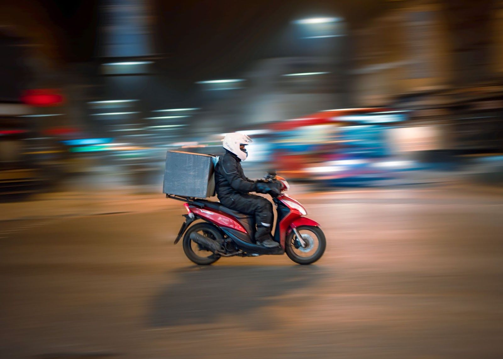 Deliveryperson speeding on a two-wheeler.
