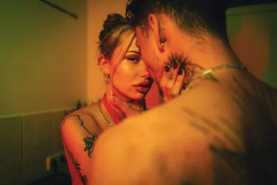 A woman and man holding each other