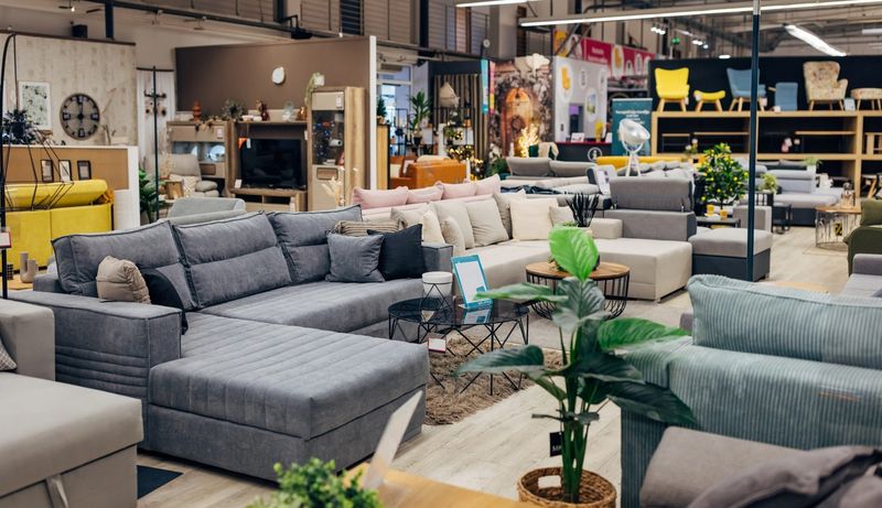 Furniture showroom with multiple sofas and floor sample inventory on display