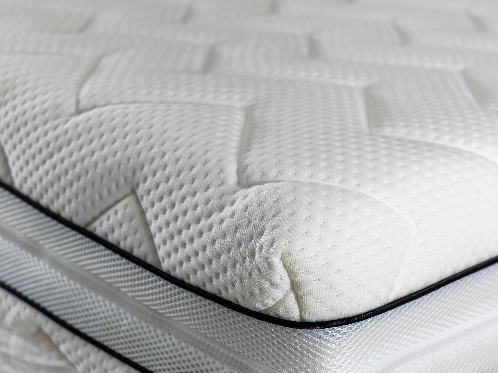 Close-up of floor model mattress showing quilted surface and premium construction