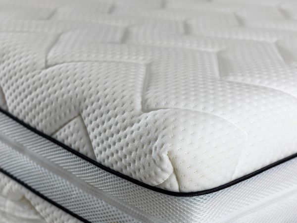 Close-up of floor model mattress showing quilted surface and premium construction