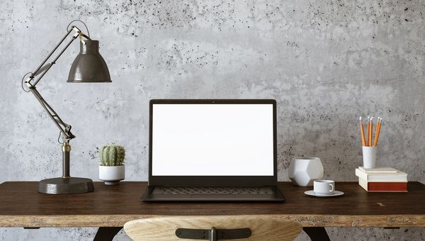 Floor model desk and table setup styled for a living room or home office