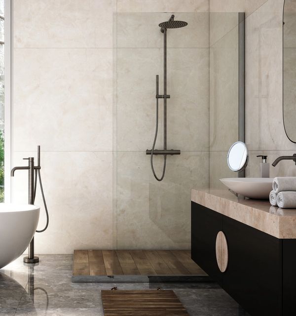 Floor model kitchen and bathroom faucet installed in showroom with stone countertop and modern fixtures