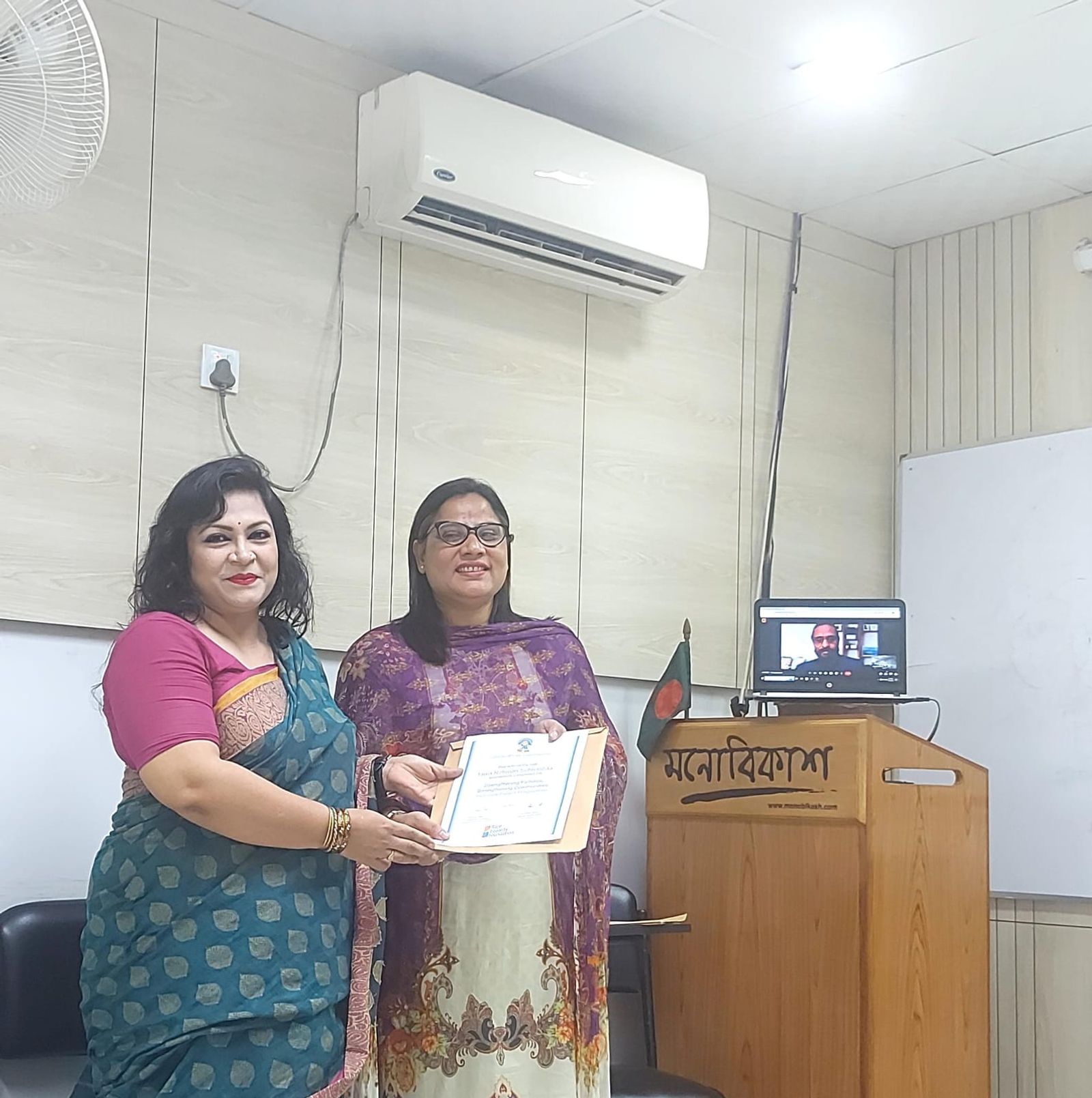 Tania Subhashita receiving her Strengthening Families, Strengthening Communities (SFSC) parenting programme certificate