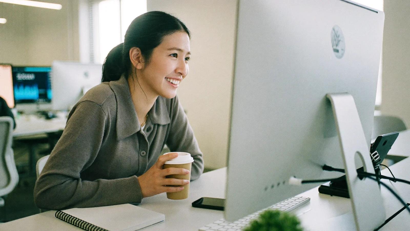 A recruiter reviewing applications at her desk