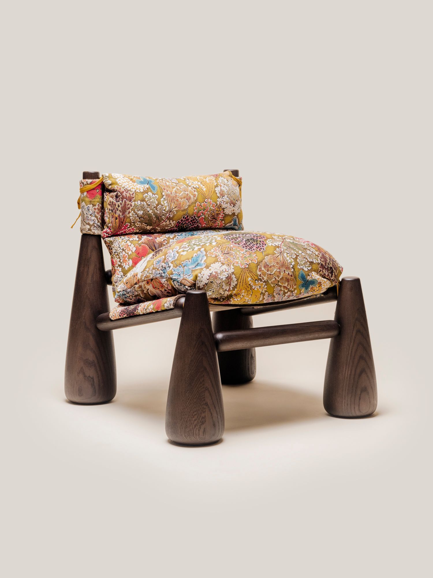 Bell Chair with a walnut finish and tapestry fabric