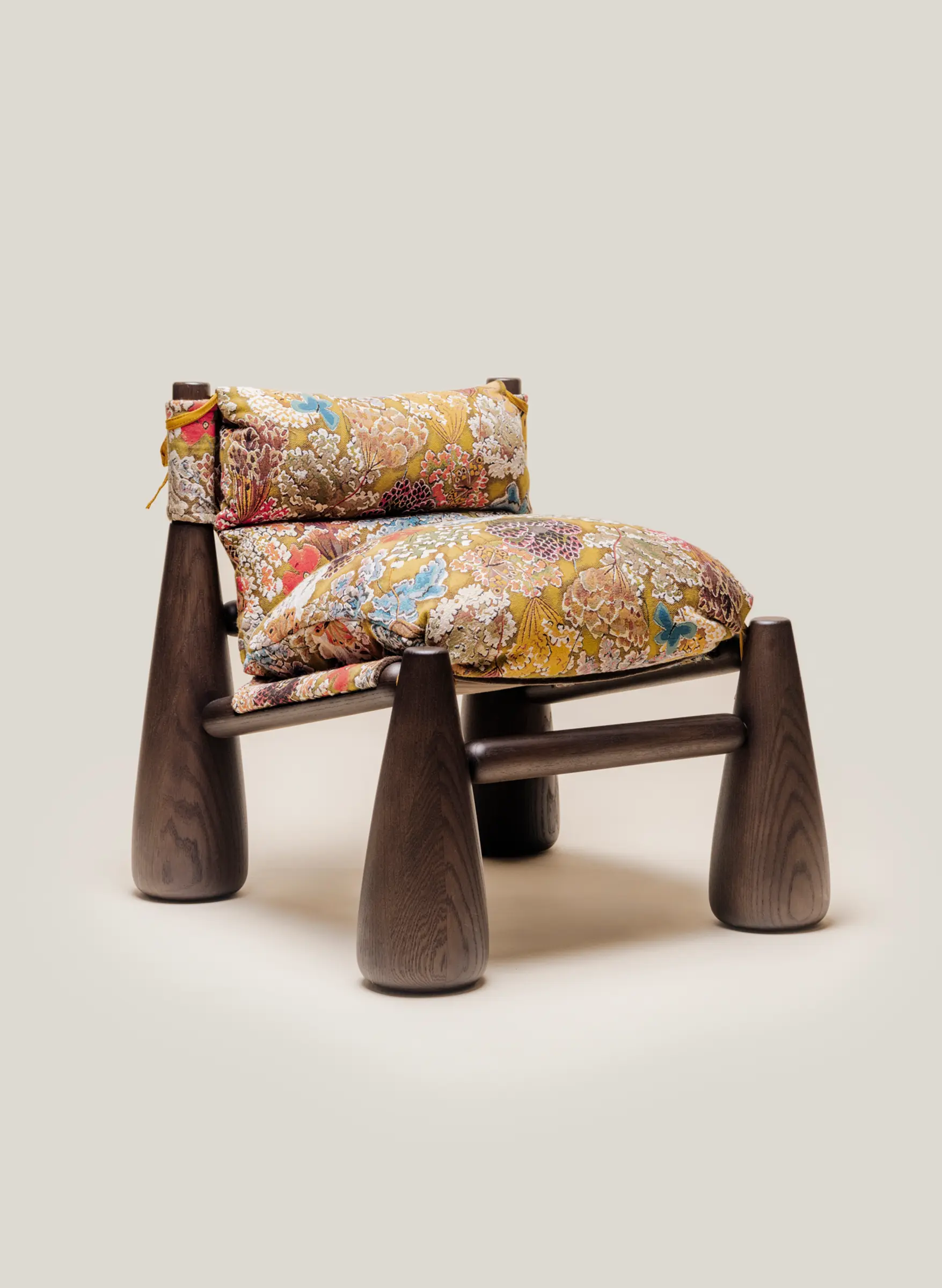 Bell Chair with a walnut finish and tapestry fabric