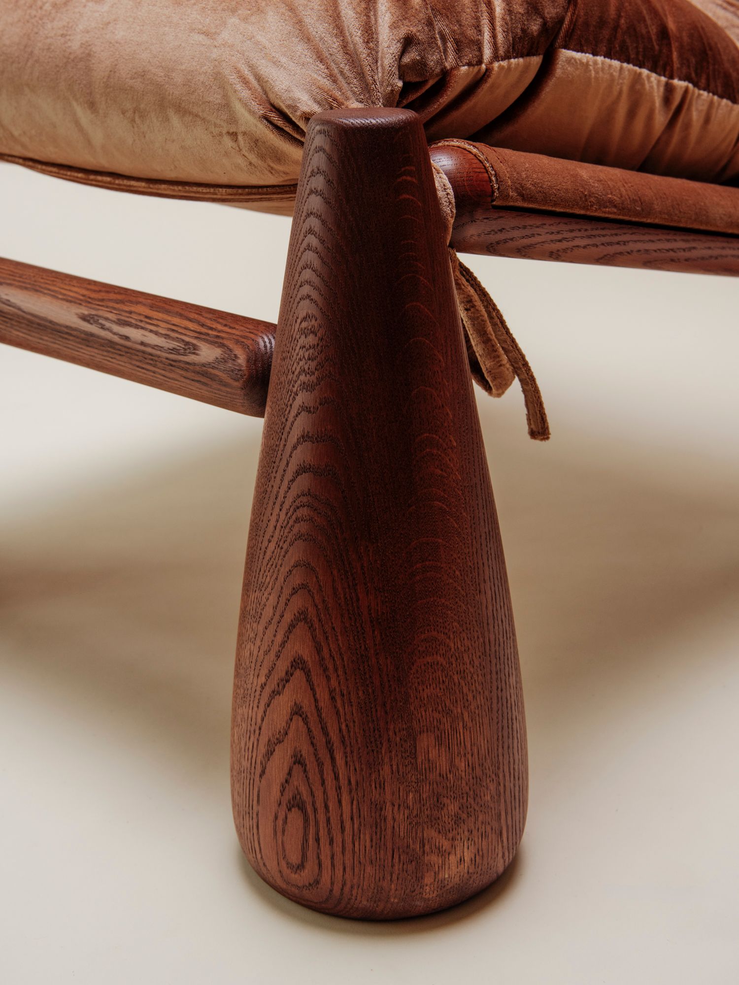 detail of bell chair with pink velvet bow and bourbon finish