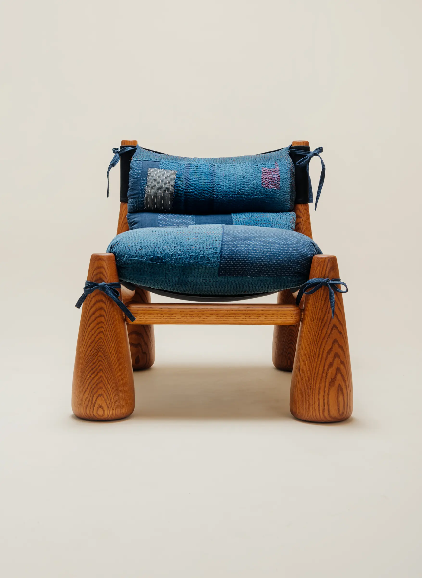 wood chair with patchwork fabric made from indigo kanthas