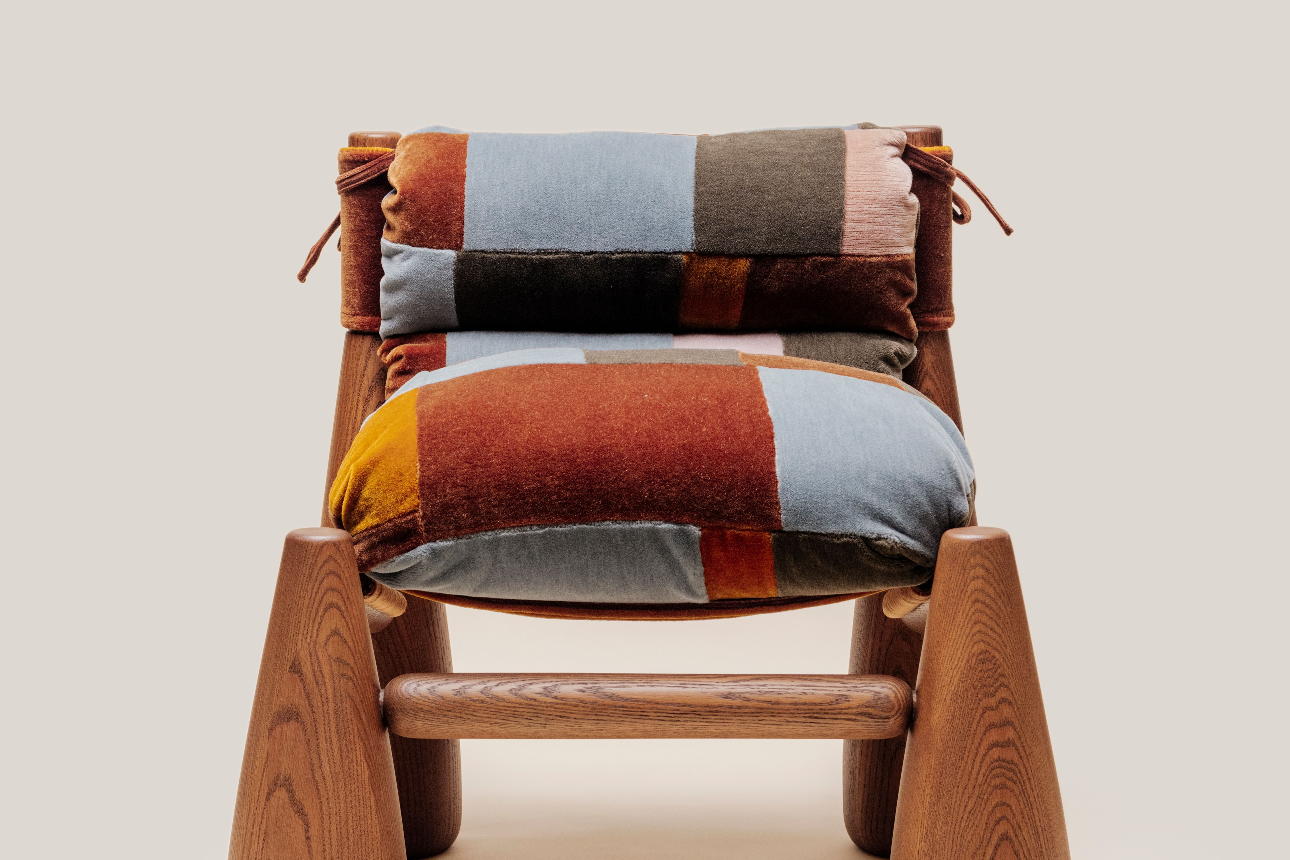 Close up of the heirloom bell chair patchwork fabric details. 