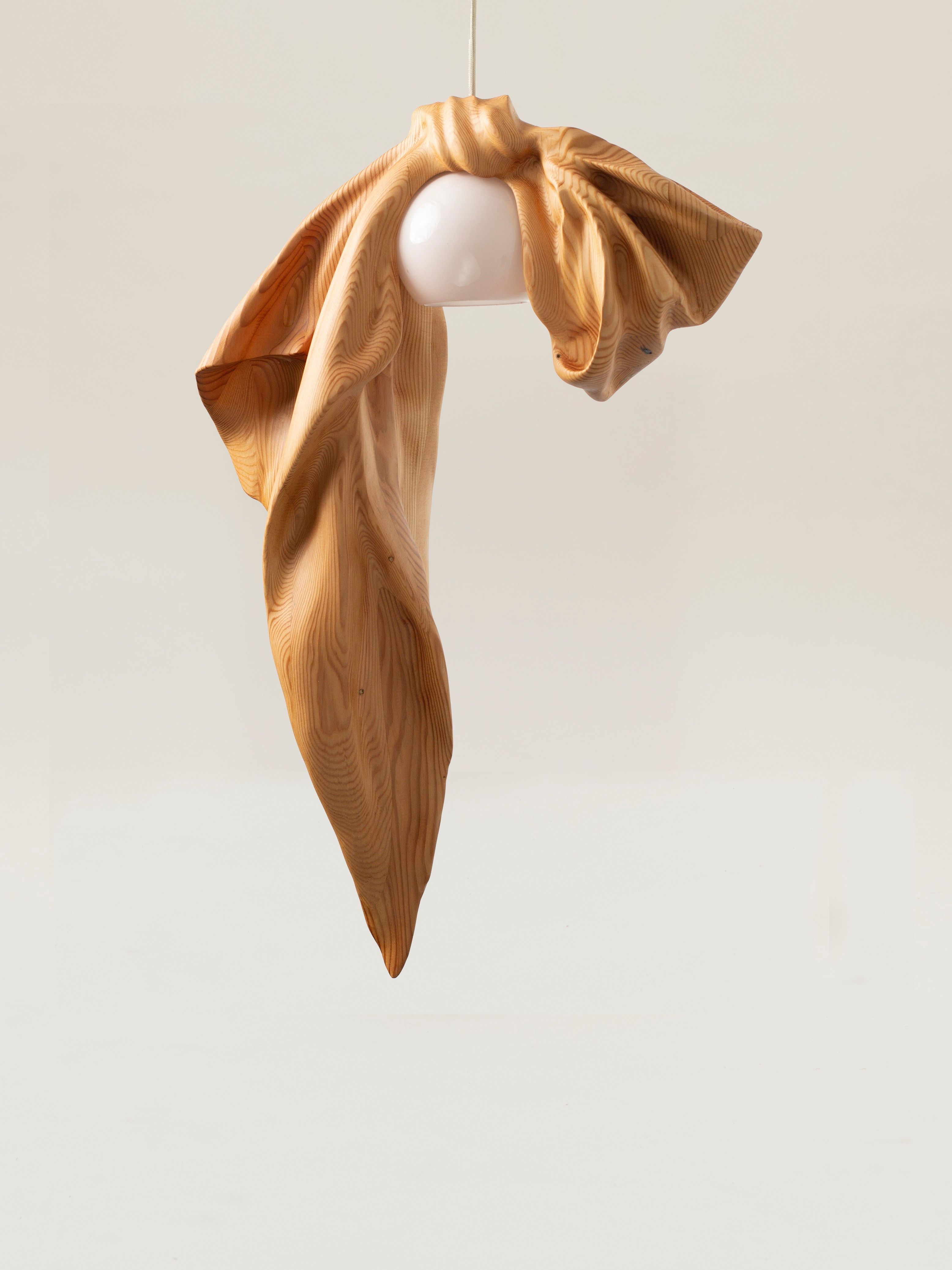 Light fixture that looks like a ribbon tied into a bow