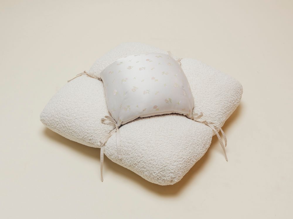 petal floor cushion in boucle and silk fabrics