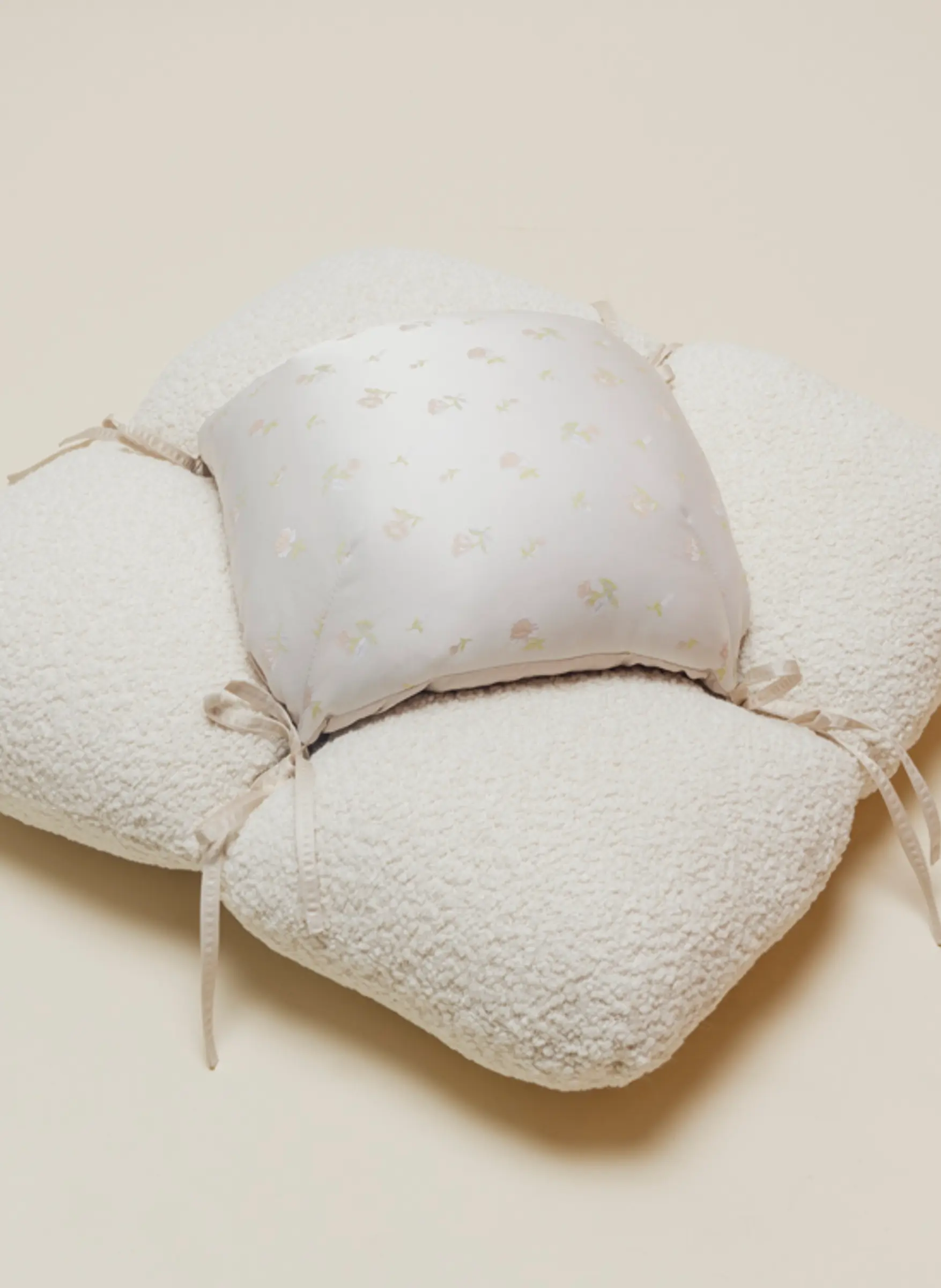 petal floor cushion in boucle and silk fabrics