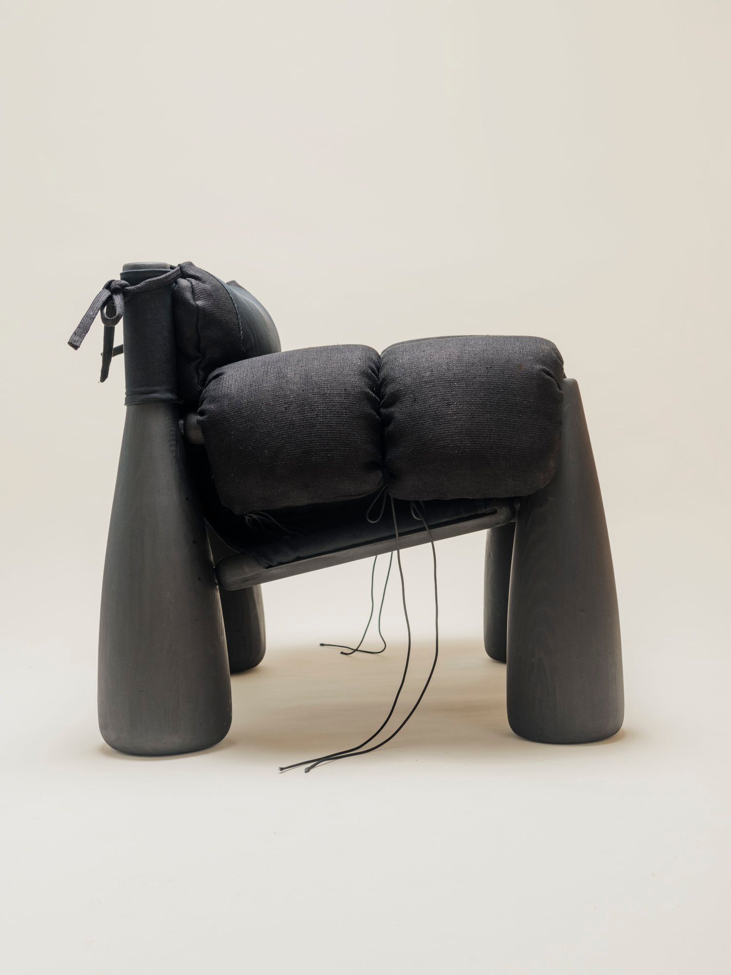 side view of big black wooden chair