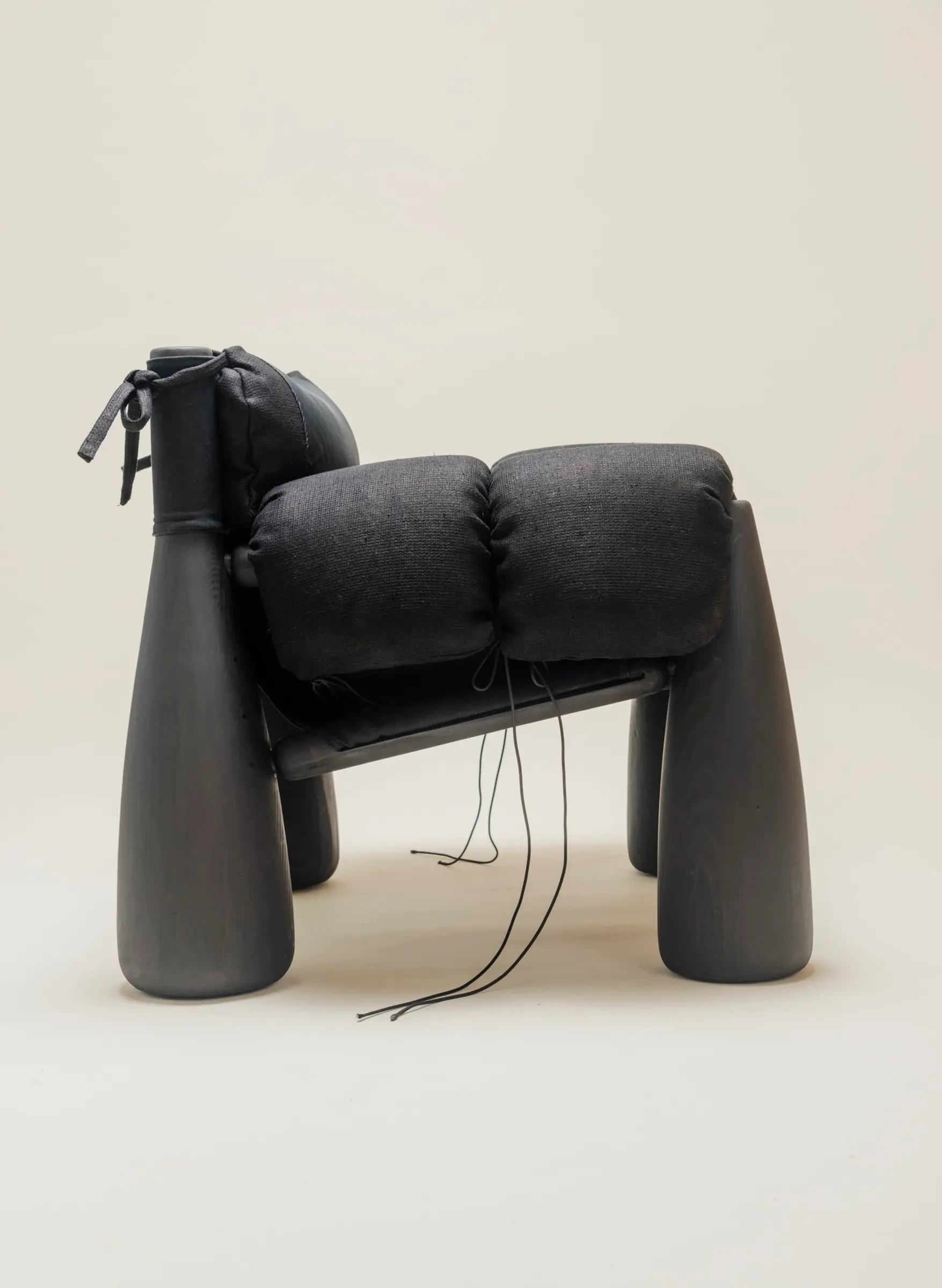 side view of big black wooden chair