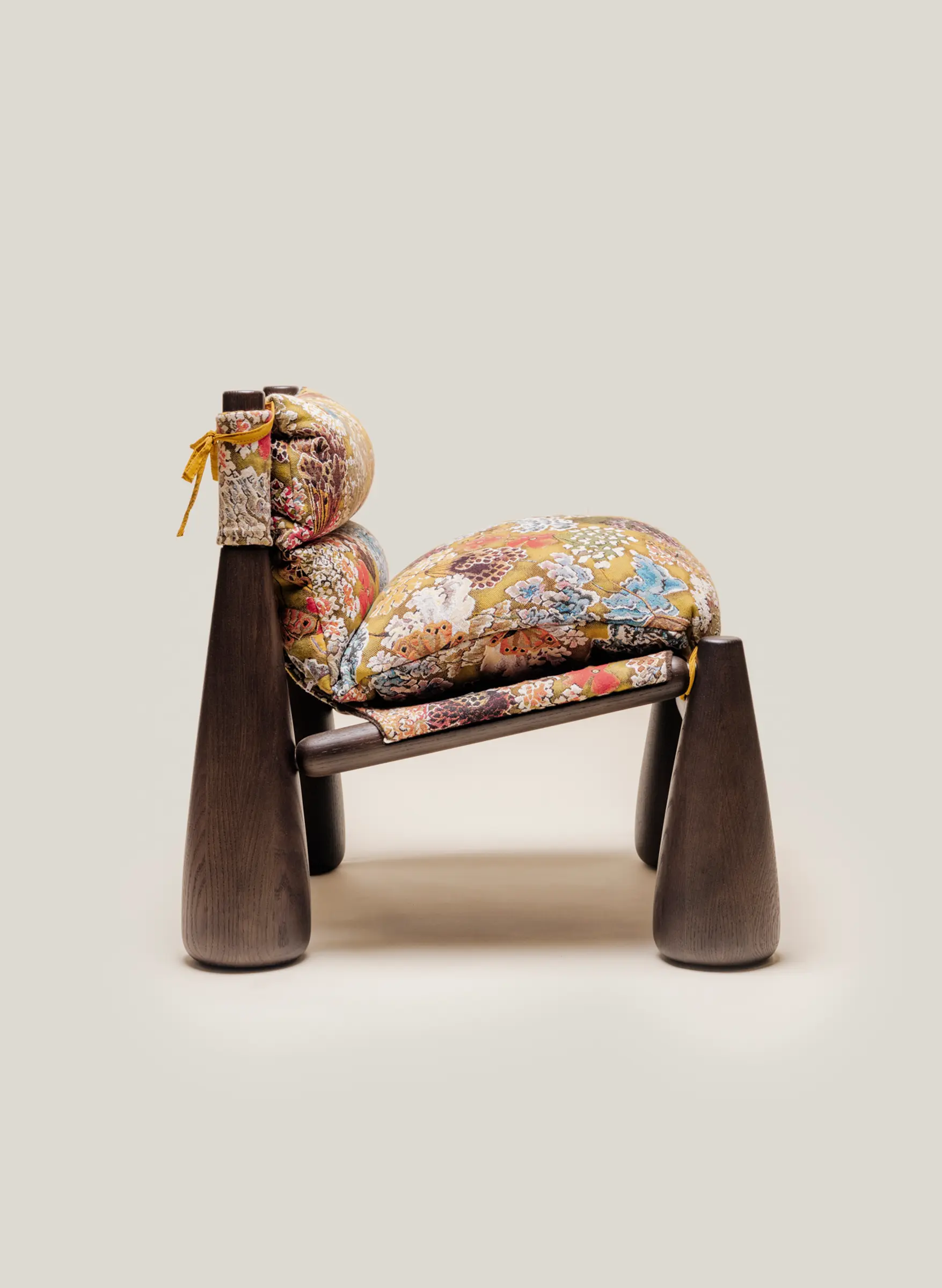 Profile view of Bell Chair in french tapestry fabric