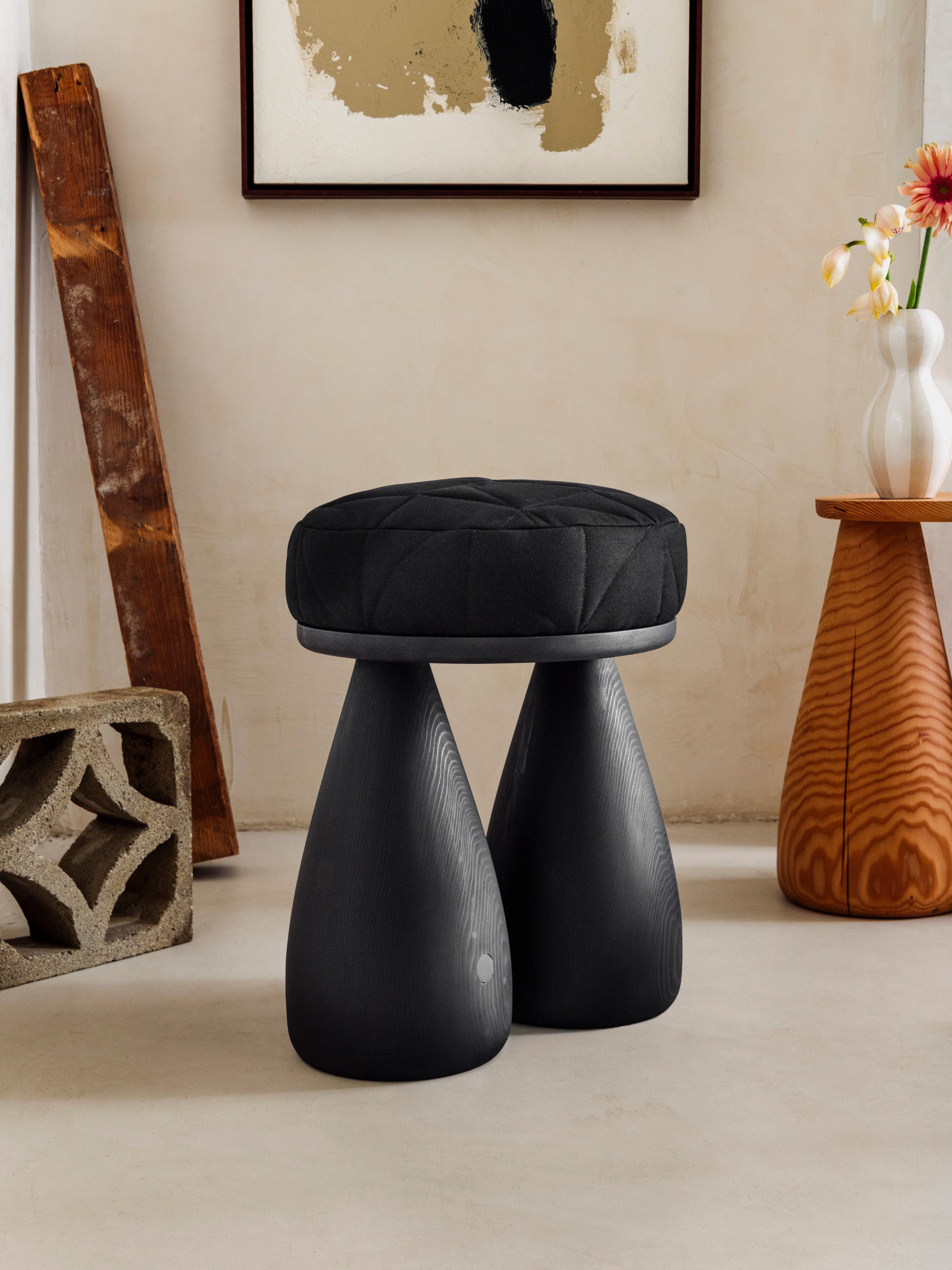 stool with black wood and black cushion