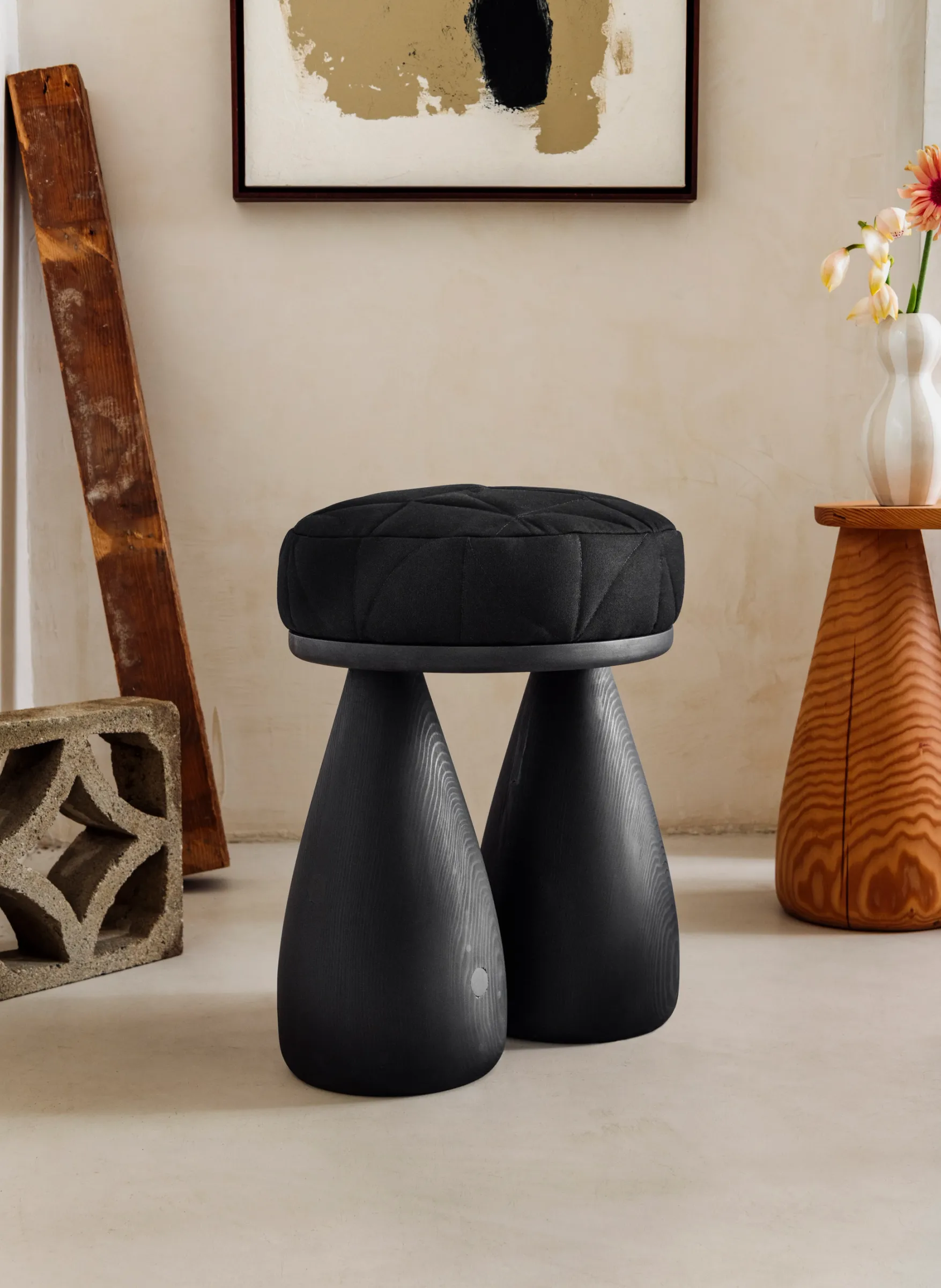 stool with black wood and black cushion