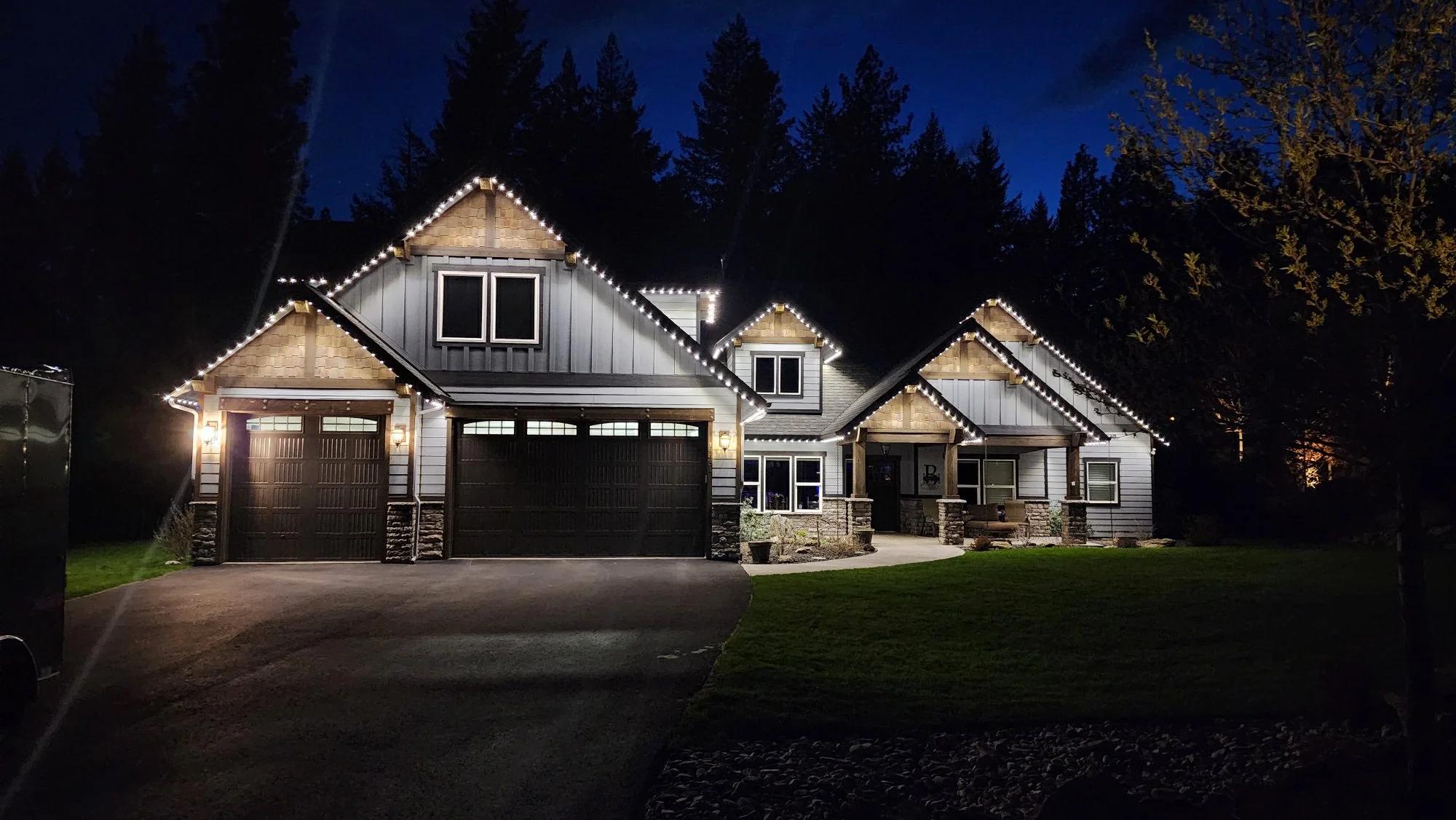 Luxury home in woods with cool white light. Lighting is even across entire home.