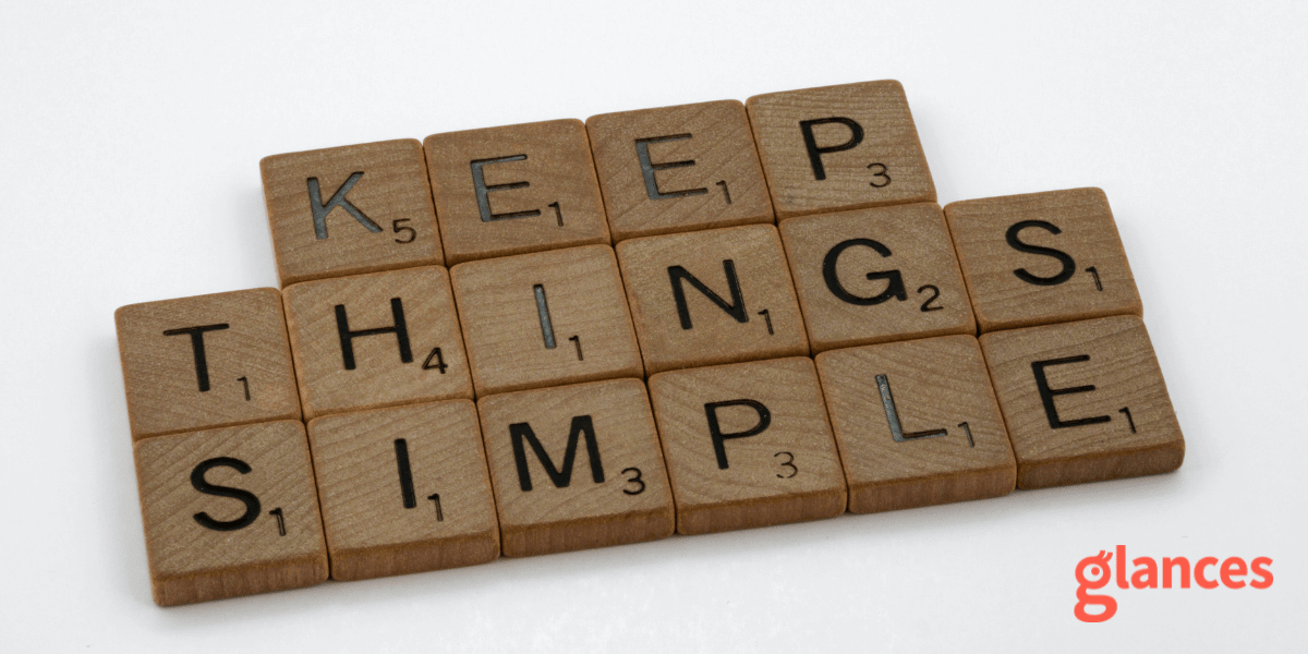 Stack of Scrabble letters on white background that spell Keep Things Simple