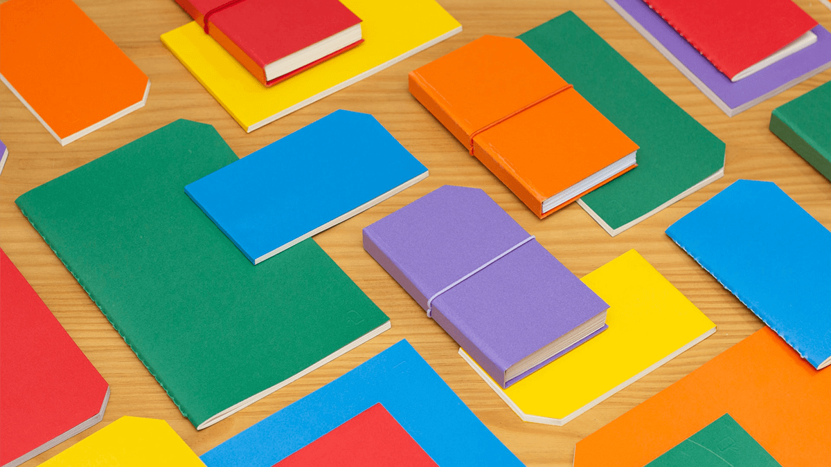 Graphic of colorful folders laid out on desk