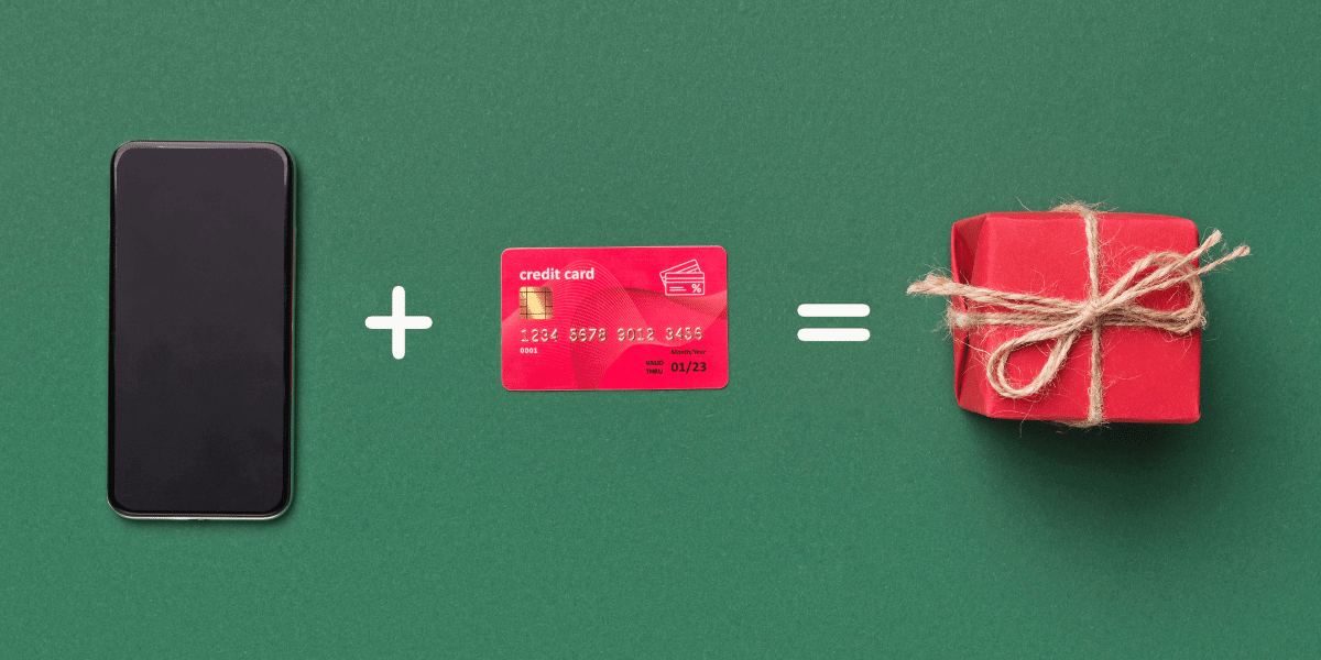 Phone, credit card, and gift on a green background