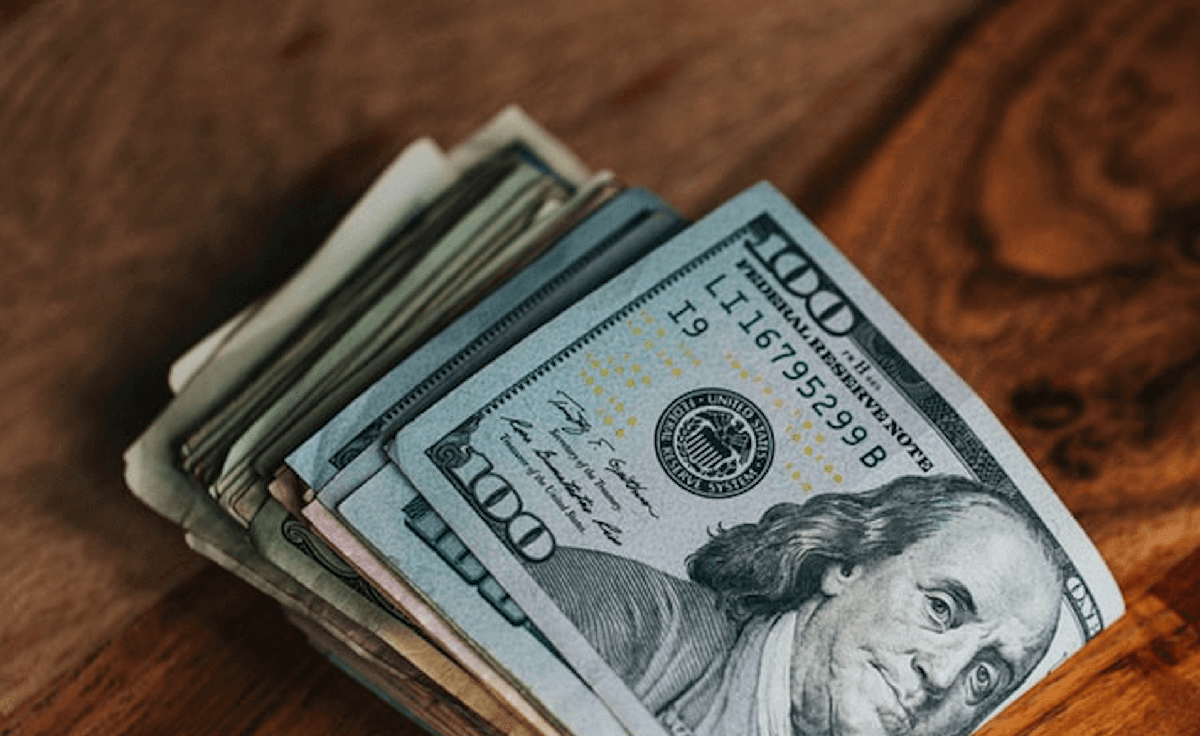 Stack of money sitting on table