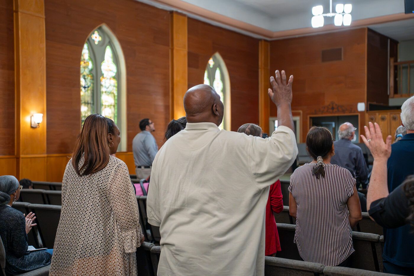 People at CLA lifting their hands in worship