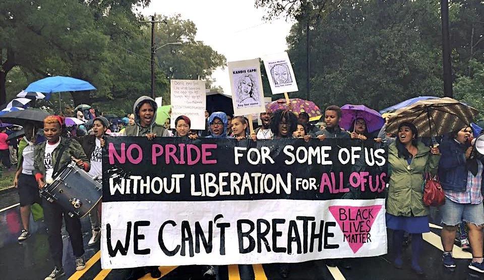 A group of people marching during North Carolina Pride in Durham, NC