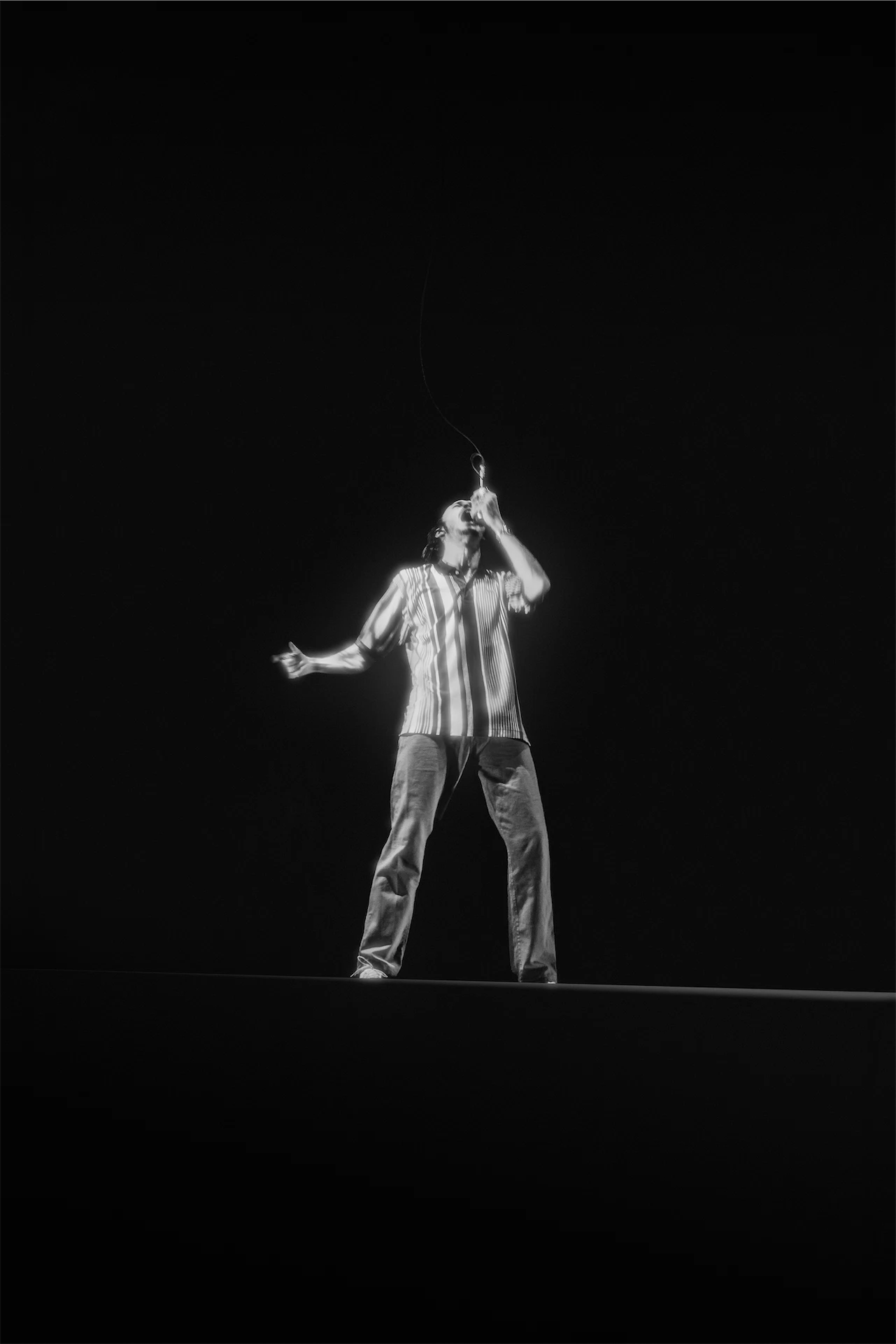 Roméo Elvis on stage Bercy black and white