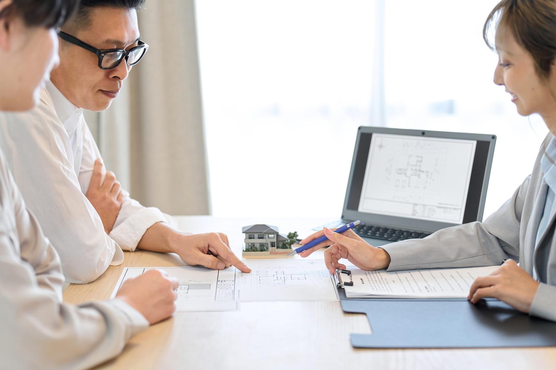 Site plan and feasibility documents spread on a table for a Pacific Northwest development project