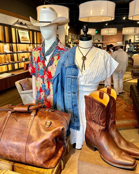 Interior of a boot store with shelves of various styles of western clothing
