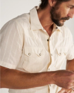 Closeup detail view of Men's Vintage Weight Short Sleeve Pearl Snap - Light Sand/Multi
