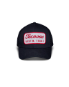 Front view of Mechanic 6-Panel Mid Pro Trucker - Black on plain background
