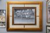 black and white image of a rodeo in a gold photo frame