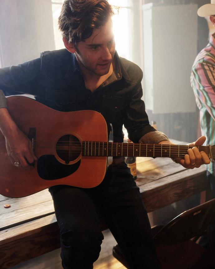 Man playing guitar and singing 