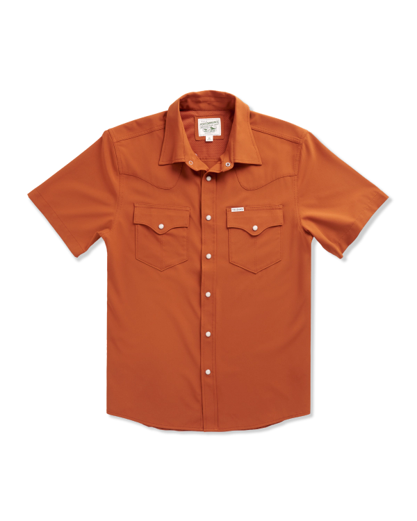 Short-sleeve, button-up orange shirt with two front chest pockets and white snap buttons, laid flat on a white background.